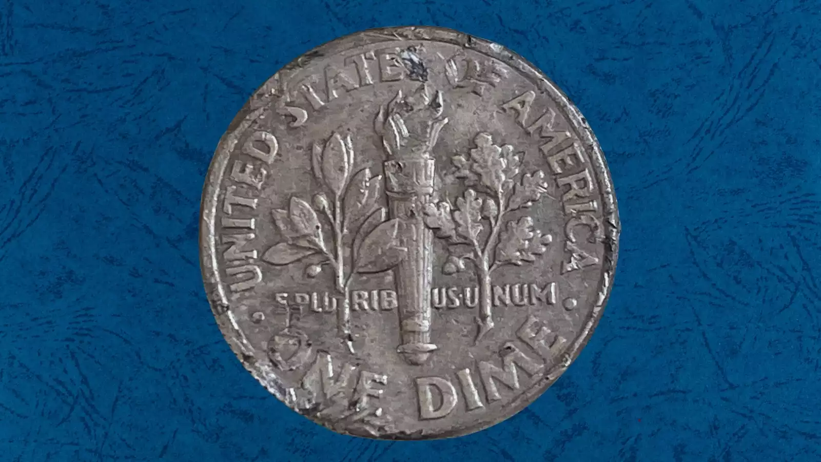 2006 dime strike-through error showing impression of foreign material on obverse